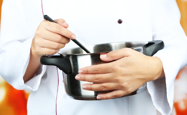 Chef preparing meal in bright kitchen